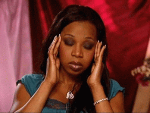 GIF of a woman rubbing her temples as she things about all the wordpress maintenance she has to do