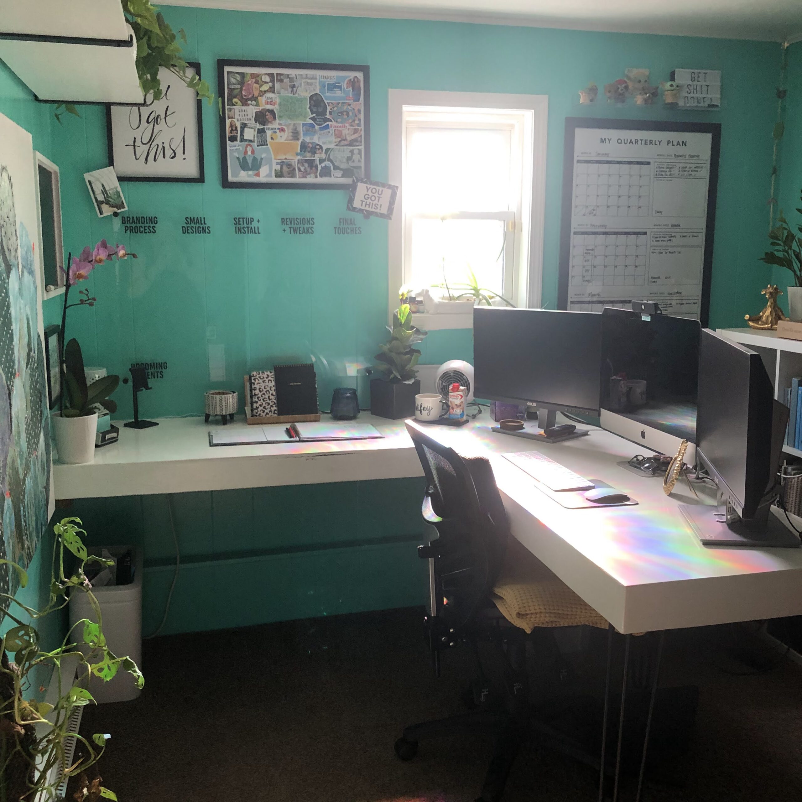 work from home desk setup with three monitors